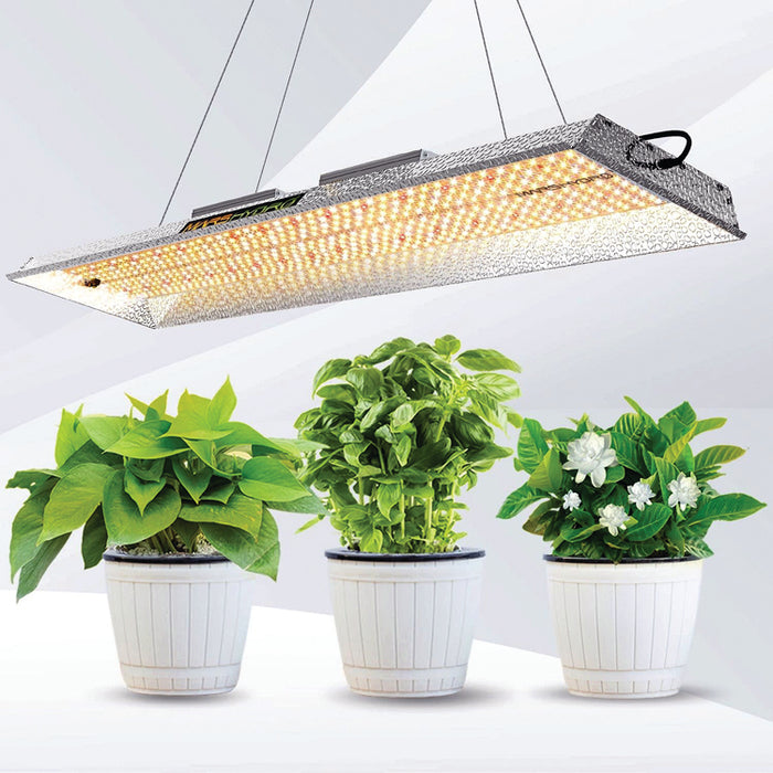 40" L Mars Hydro TSL-2000 LED Grow Light over three houseplants