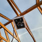 Heat Saver Fan: A bottom view of the product hanging in a greenhouse.